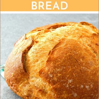 naturally leavened sourdough loaf sitting on a green towel