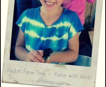 girl holding a chick