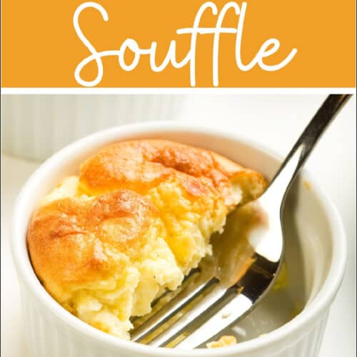 cheese soufflé in a ramekin with a fork