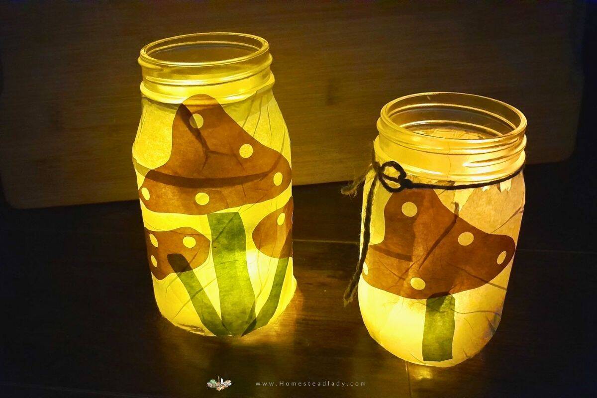 tissue paper mason jar lanterns with mushrooms on a wooden table