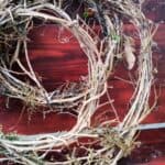 round grape vine garland on a bench