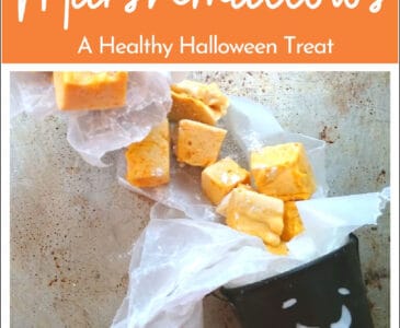 naturally dyed orange marshmallows on a tray