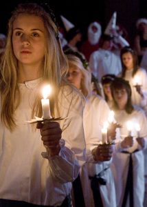 Children holding candles