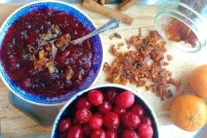 A bowl of cranberry relish on a plate, with Cranberry