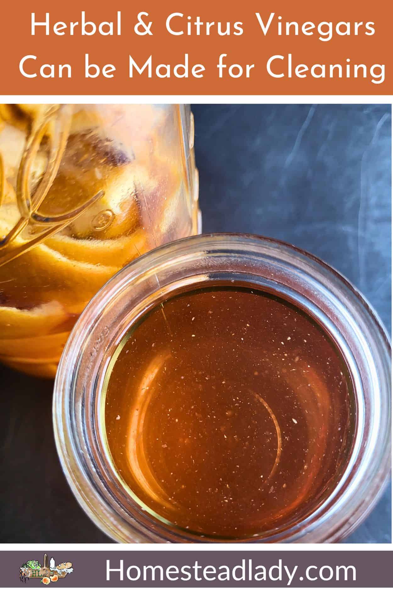 herbal infused vinegar with citrus peels in a jar sitting on a metal table
