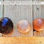 dorodango balls sitting on wood