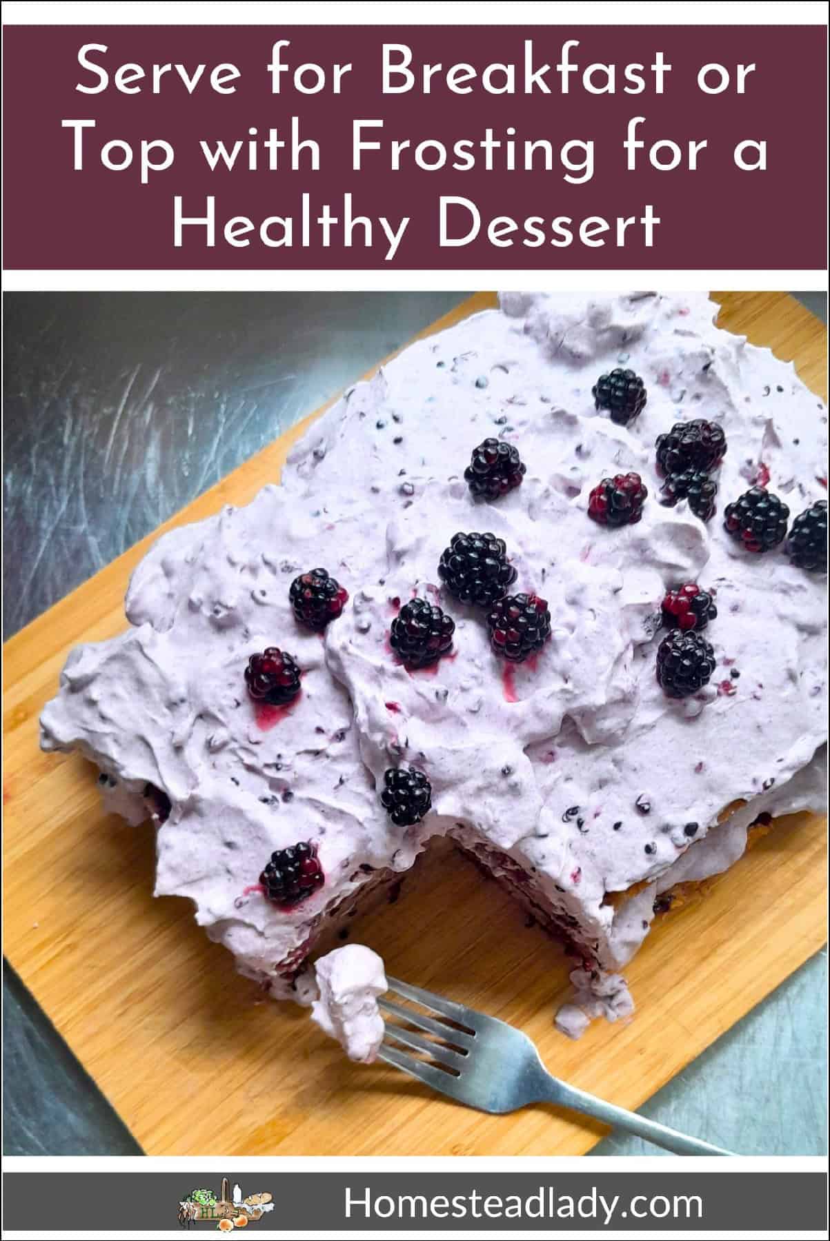 sourdough blackberry cake on a board with a fork