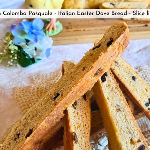 sourdough Colomba Pasquale Easter dove bread sliced on a white tablecloth