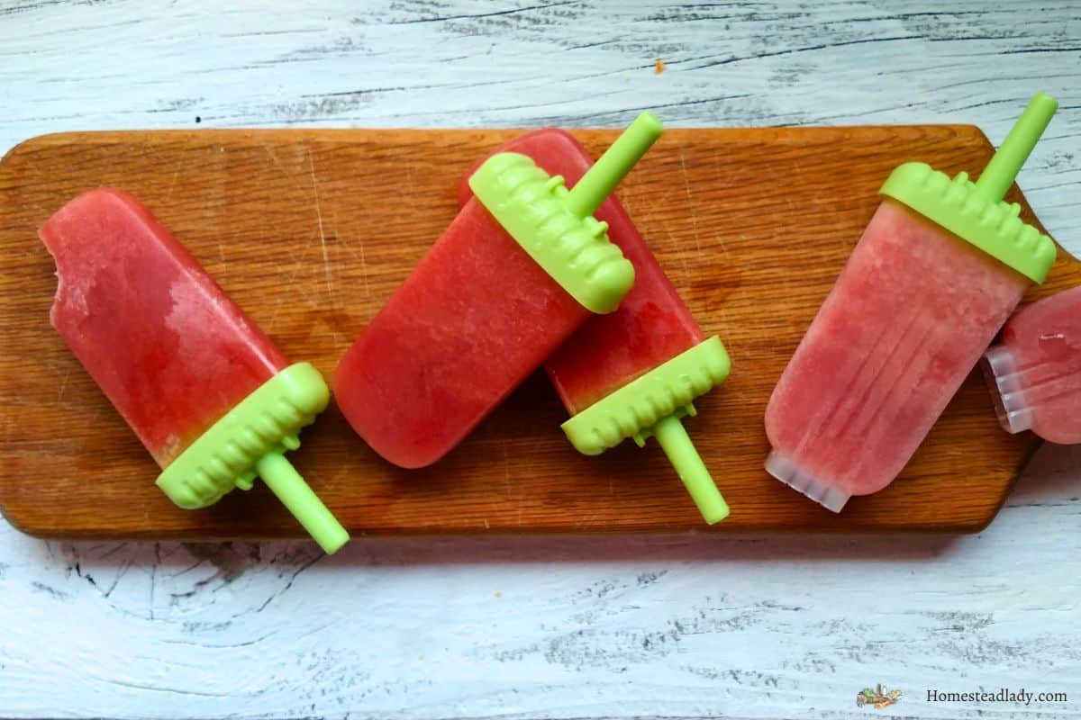 basil watermelon popsicles on a cutting board