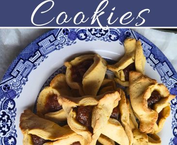 gluten free Hamataschen cookies on a blue and white plate